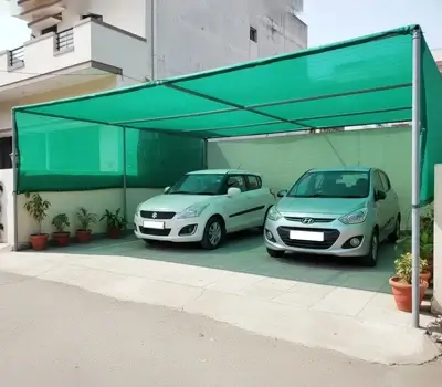 Green parking shade net structure covering two cars